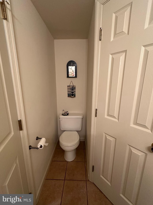 bathroom featuring tile patterned flooring and toilet