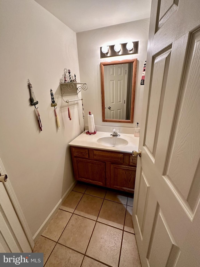 bathroom featuring tile patterned flooring and vanity