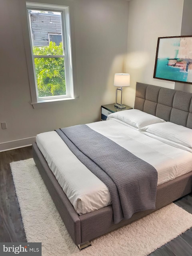 bedroom featuring wood-type flooring