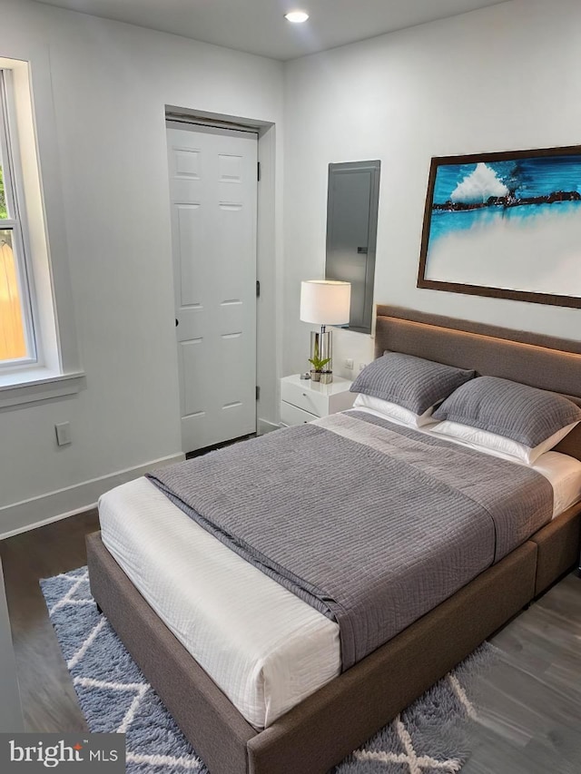 bedroom featuring dark wood-type flooring