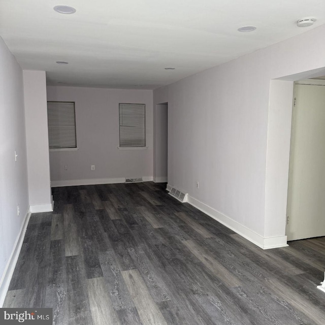 empty room featuring dark hardwood / wood-style floors