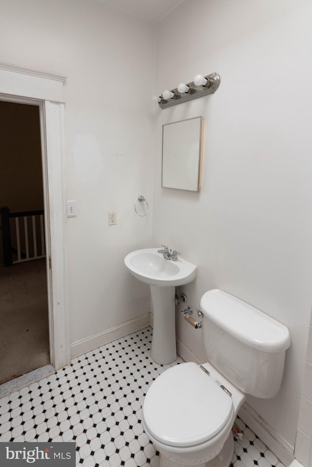 bathroom with sink and toilet