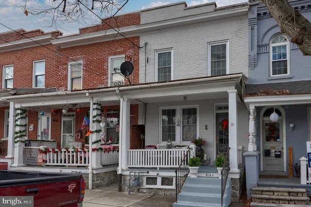 view of property featuring a porch