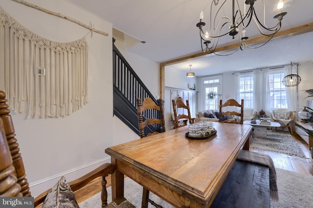 dining room with a chandelier and hardwood / wood-style floors