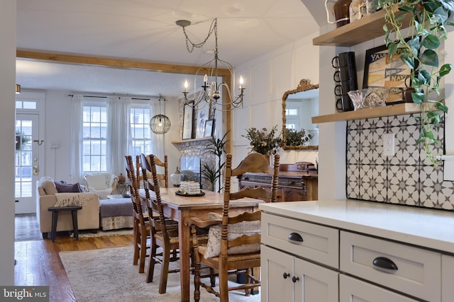 dining room featuring a notable chandelier and dark hardwood / wood-style flooring