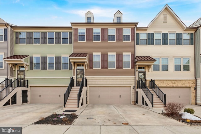 multi unit property featuring a garage