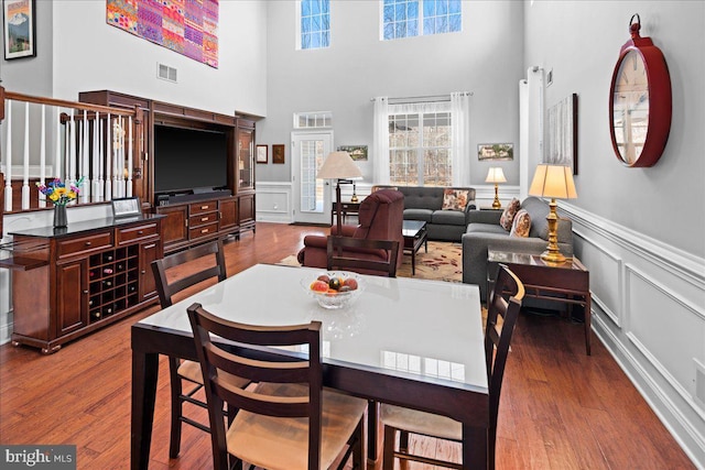 dining space featuring wood-type flooring