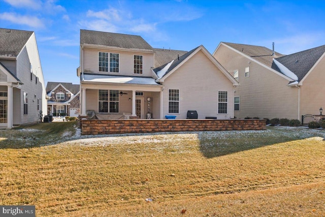 view of property with a front yard and a patio