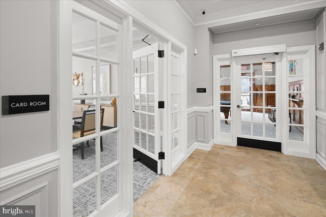 interior space featuring crown molding and french doors