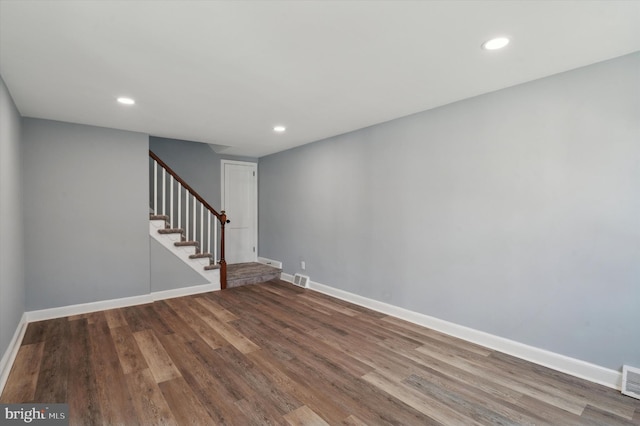 unfurnished room with hardwood / wood-style flooring