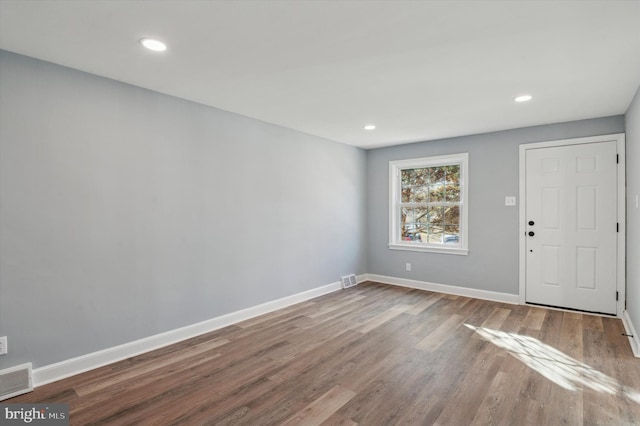 entryway with hardwood / wood-style flooring