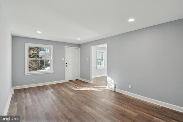 foyer entrance with a healthy amount of sunlight and hardwood / wood-style floors