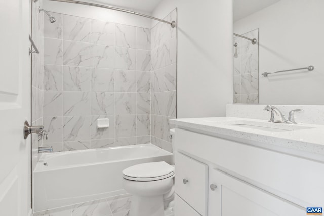 full bathroom featuring vanity, toilet, and tiled shower / bath