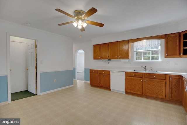 kitchen featuring white dishwasher, sink, ornamental molding, and ceiling fan