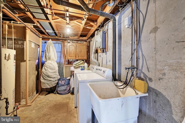 washroom with gas water heater, washer and dryer, sink, cabinets, and electric panel