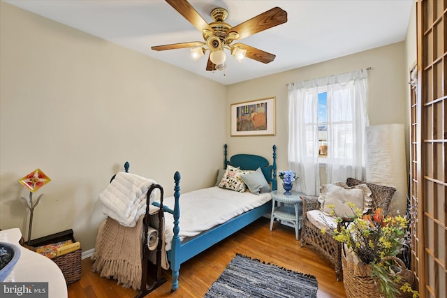 bedroom featuring wood-type flooring and ceiling fan