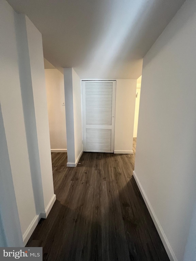 hall with dark hardwood / wood-style flooring