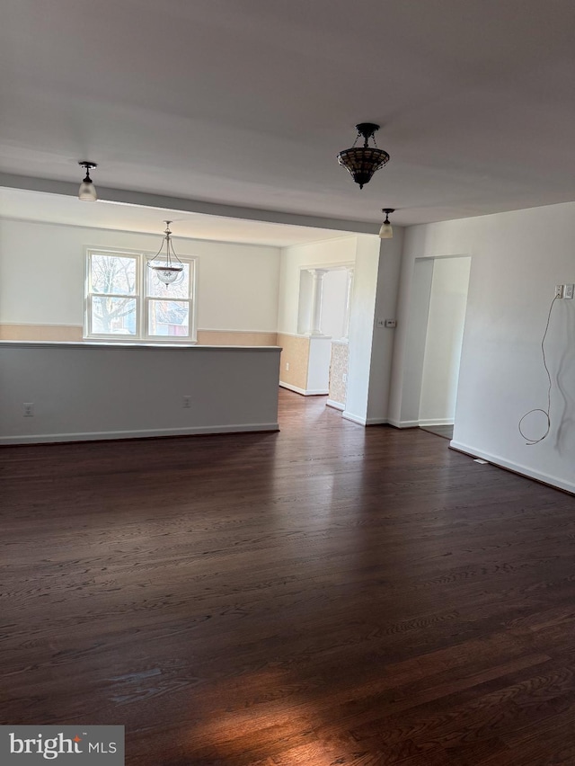 spare room with dark hardwood / wood-style floors