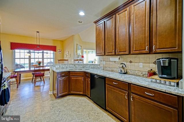 kitchen with light stone counters, a peninsula, a sink, backsplash, and dishwasher