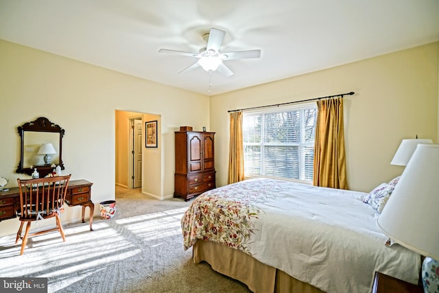 bedroom with light carpet and ceiling fan