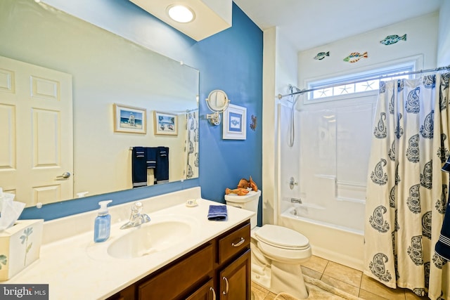 bathroom featuring toilet, shower / bath combo, vanity, and tile patterned floors