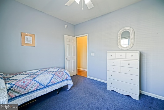 carpeted bedroom featuring ceiling fan and baseboards