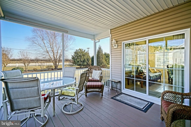 wooden deck with outdoor dining space