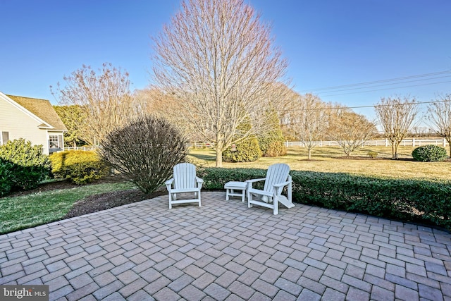 view of patio / terrace featuring fence