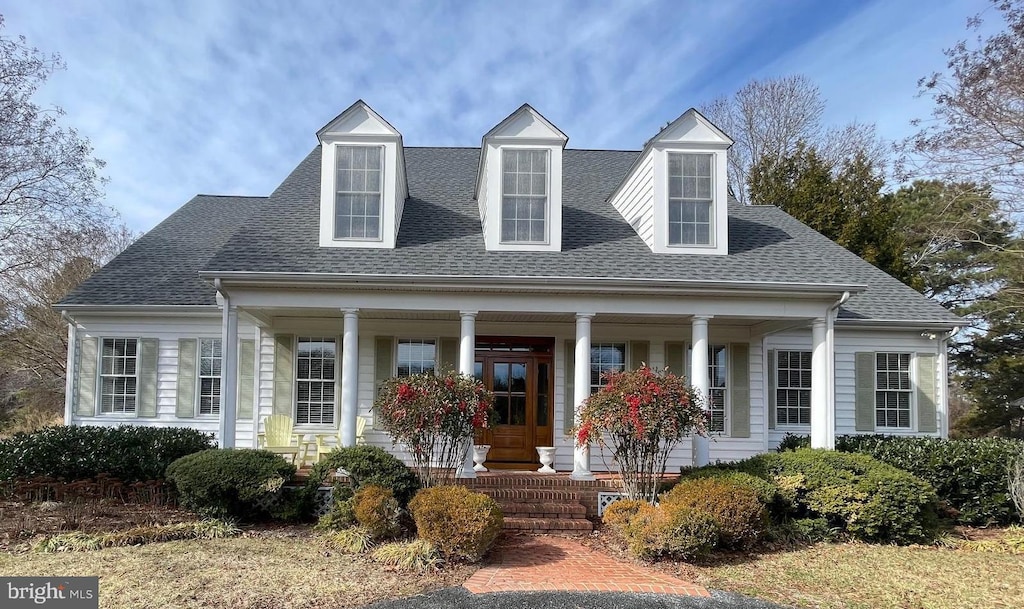 cape cod home with covered porch