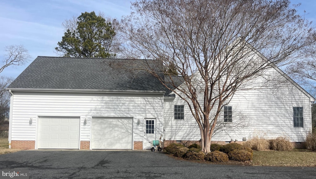 view of property exterior with a garage