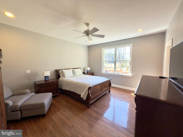 bedroom featuring dark wood-type flooring and ceiling fan