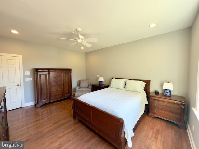 bedroom featuring dark hardwood / wood-style floors and ceiling fan