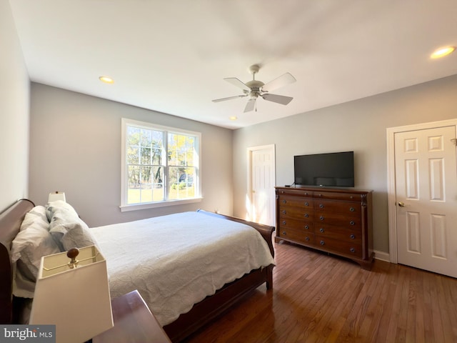 bedroom featuring dark hardwood / wood-style floors and ceiling fan