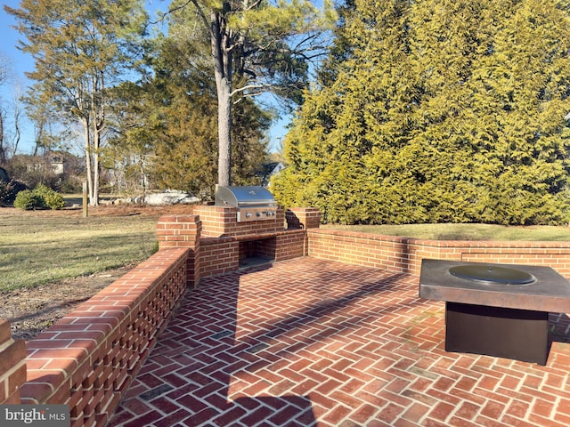 view of patio / terrace featuring grilling area and exterior kitchen