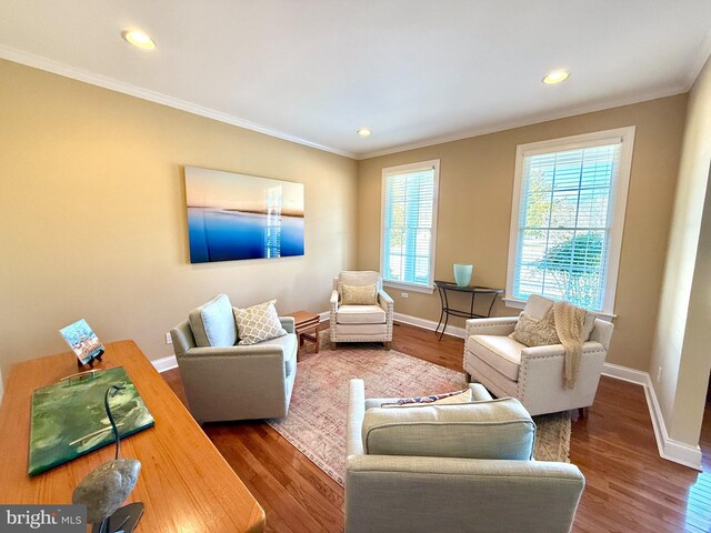 living room with ornamental molding and hardwood / wood-style floors