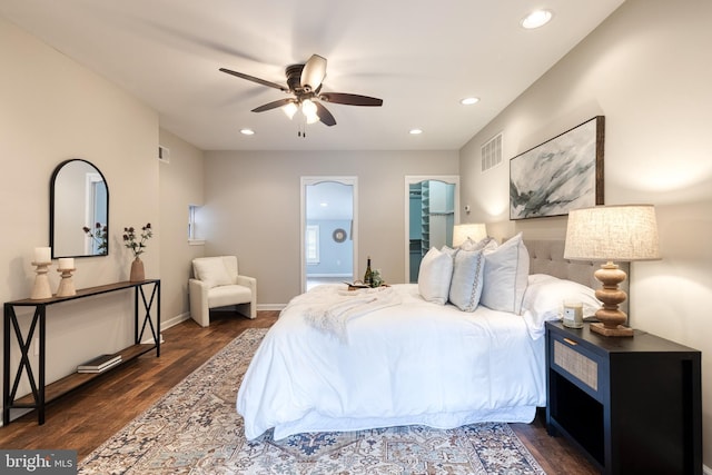 bedroom with baseboards, visible vents, dark wood finished floors, and recessed lighting