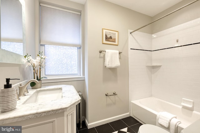 bathroom with bathing tub / shower combination, toilet, vanity, tile patterned flooring, and baseboards