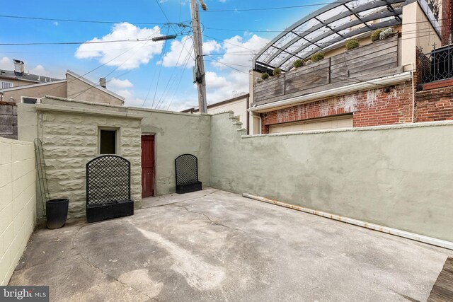 view of patio with fence