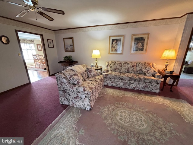 living room with carpet flooring, crown molding, and ceiling fan