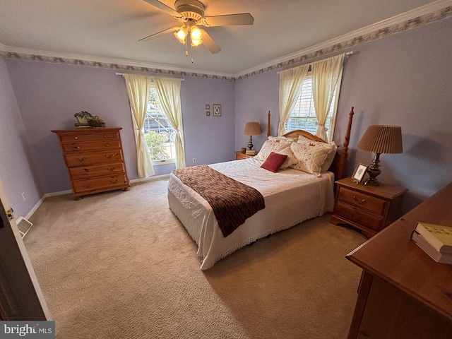 bedroom featuring a ceiling fan, light carpet, crown molding, and multiple windows