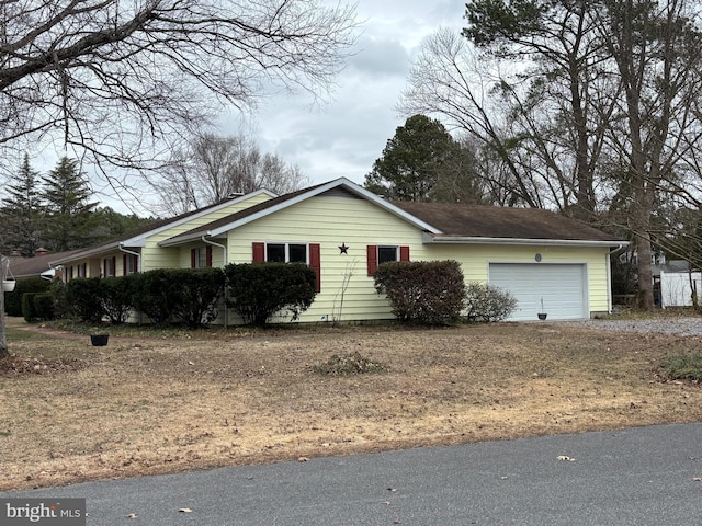 single story home with a garage