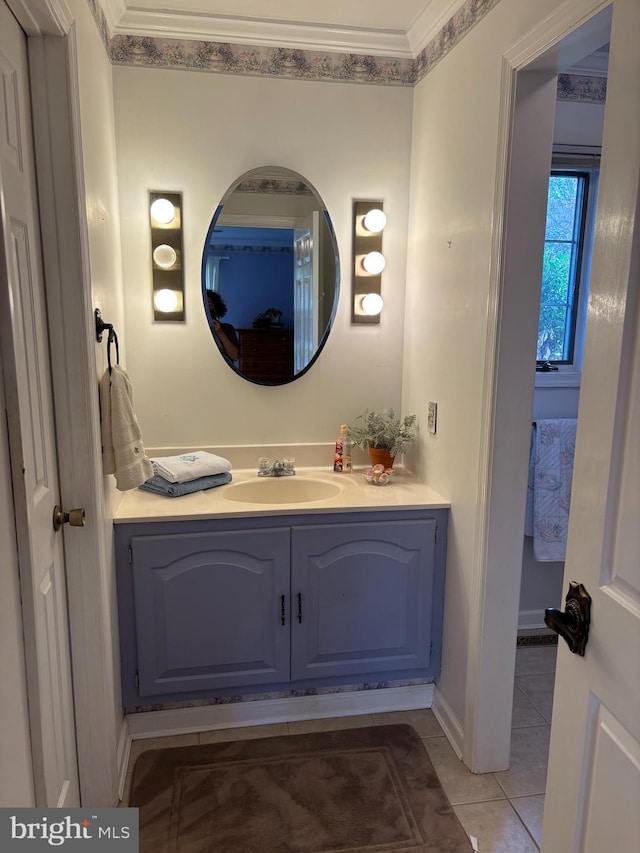 bathroom with tile patterned floors, crown molding, and vanity