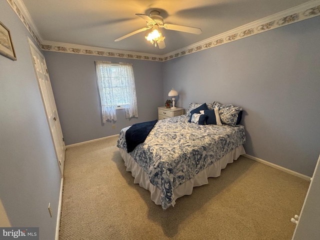 bedroom featuring baseboards, ceiling fan, ornamental molding, and light colored carpet