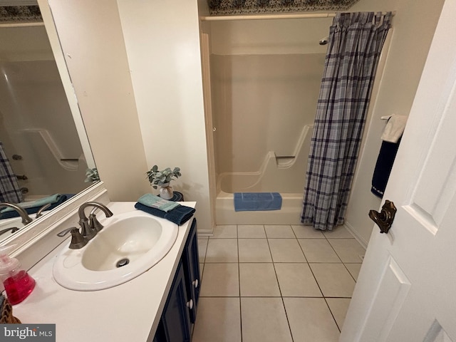 bathroom featuring tile patterned flooring, vanity, and shower / bathtub combination with curtain