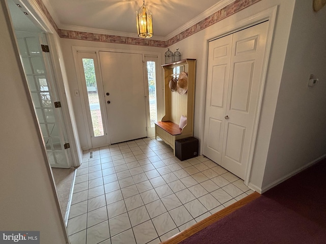 foyer featuring ornamental molding and light tile patterned flooring