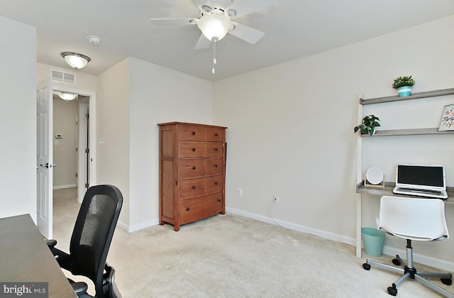 carpeted home office with ceiling fan