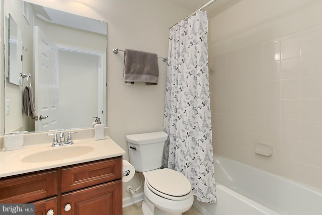 full bathroom featuring vanity, shower / tub combo with curtain, and toilet