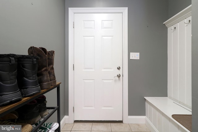 mudroom featuring light tile patterned floors and baseboards