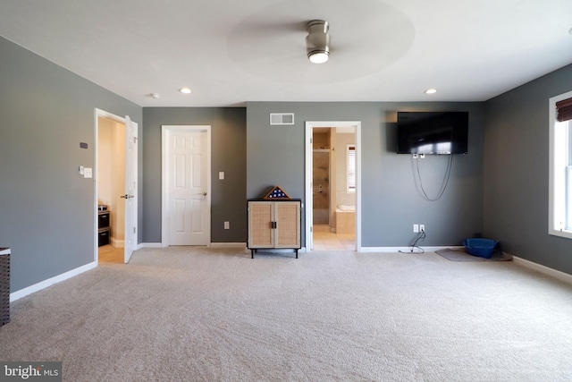 unfurnished living room with ceiling fan, recessed lighting, light colored carpet, visible vents, and baseboards