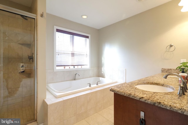 bathroom with double vanity, a bath, tile patterned flooring, a shower stall, and a sink